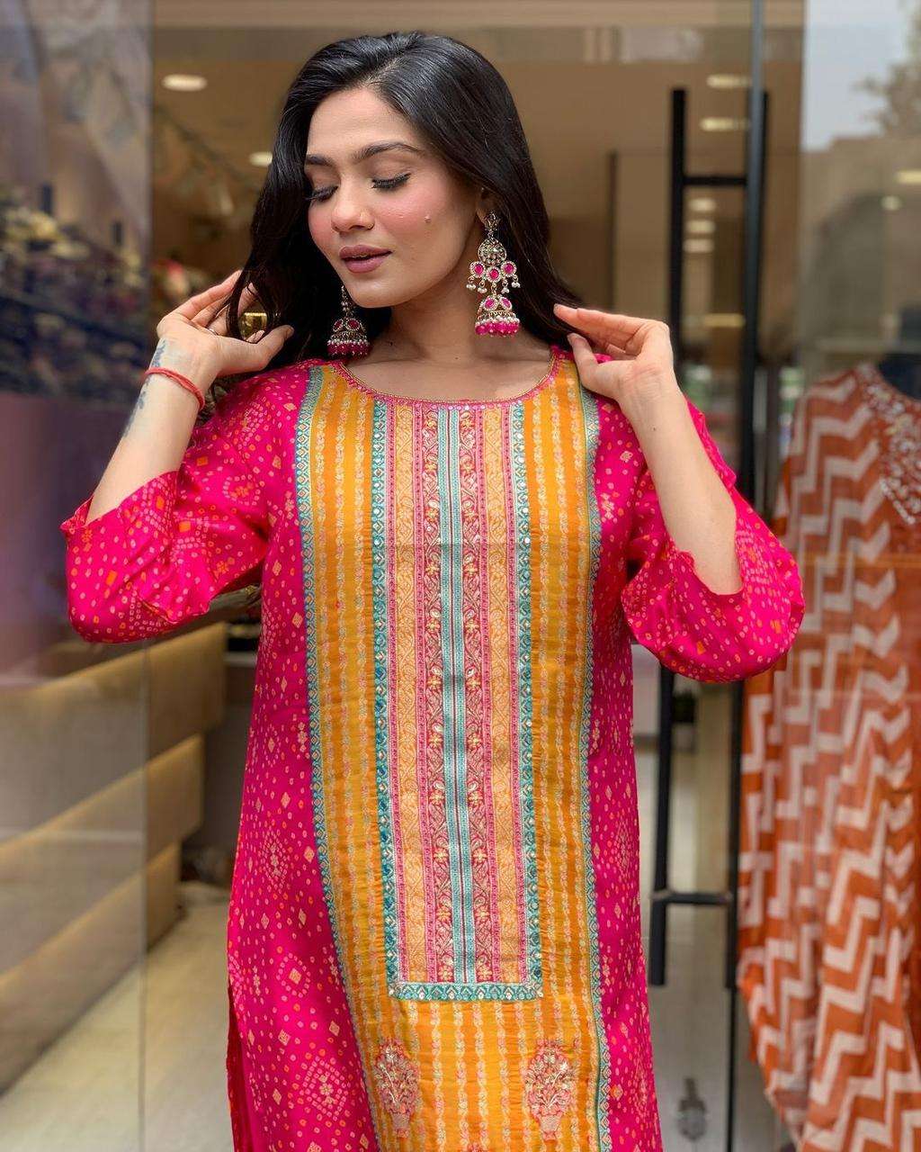 Featuring soothing yet model satin febric witt print & Stone work wholesale suit 